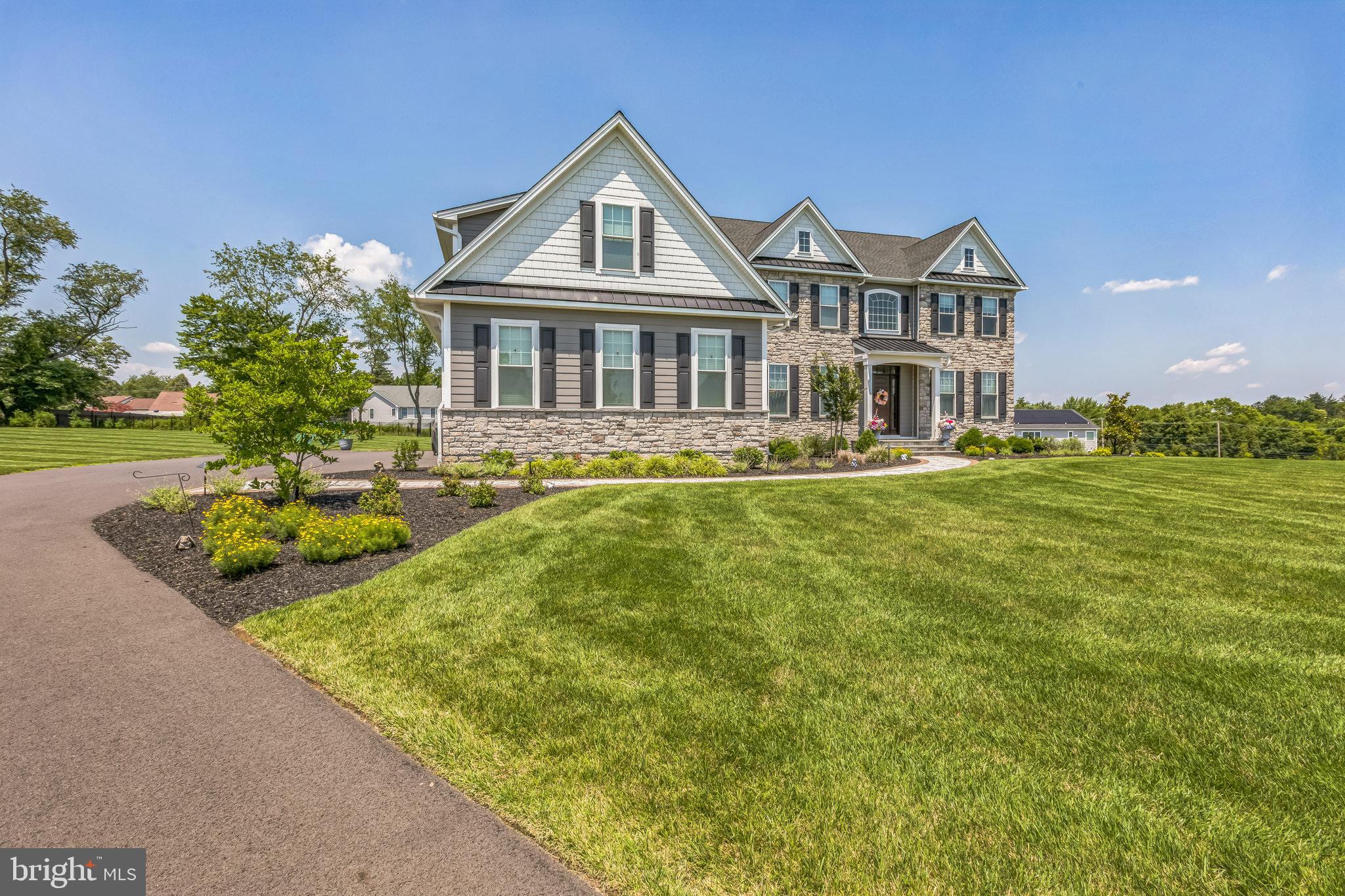 15 Marquis Ridge Holland, PA 18966 - Photo 6 of 83 a front view of a house with garden