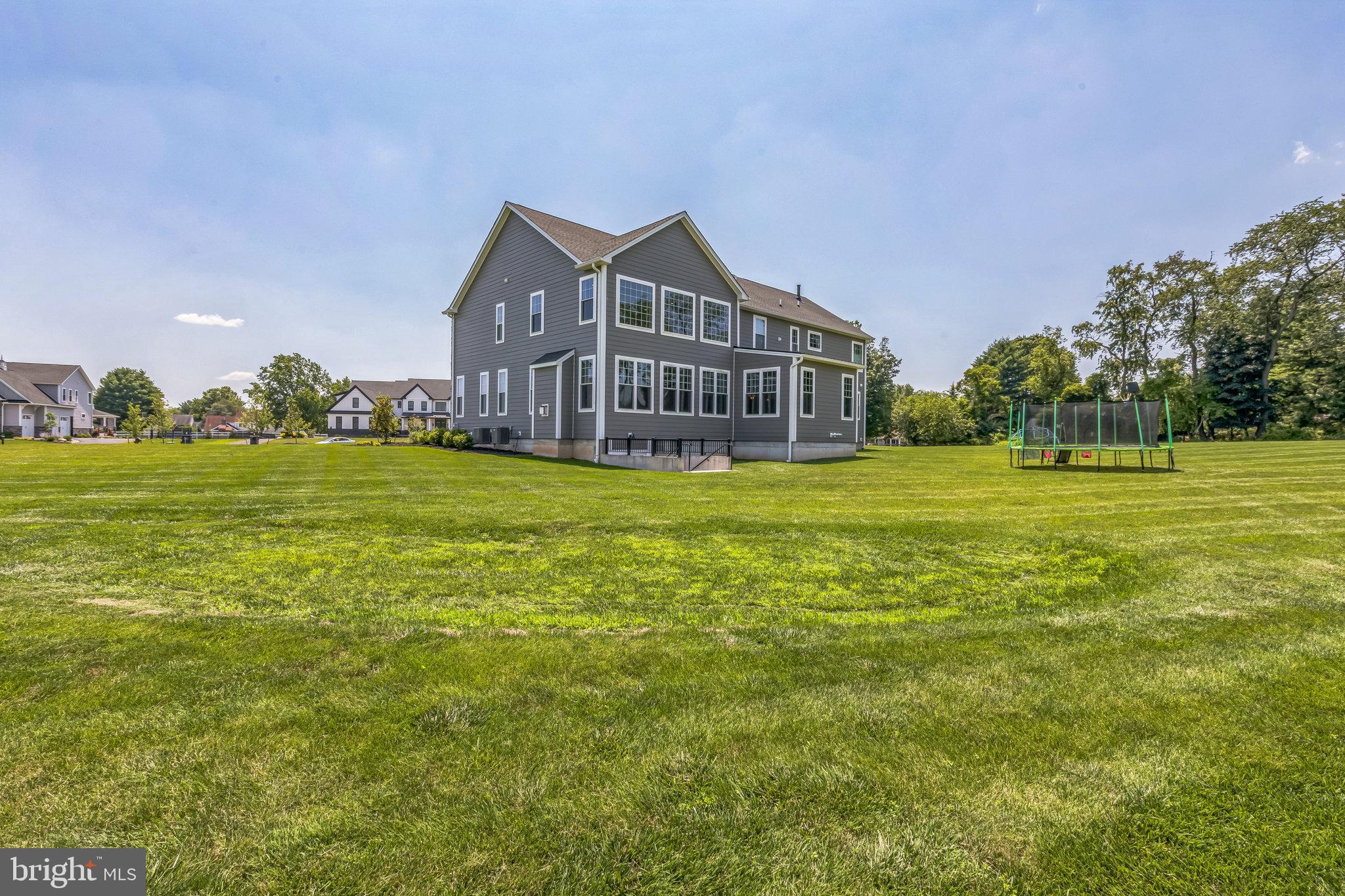 15 Marquis Ridge Holland, PA 18966 - Photo 82 of 83 a view of a big house with a big yard and large trees