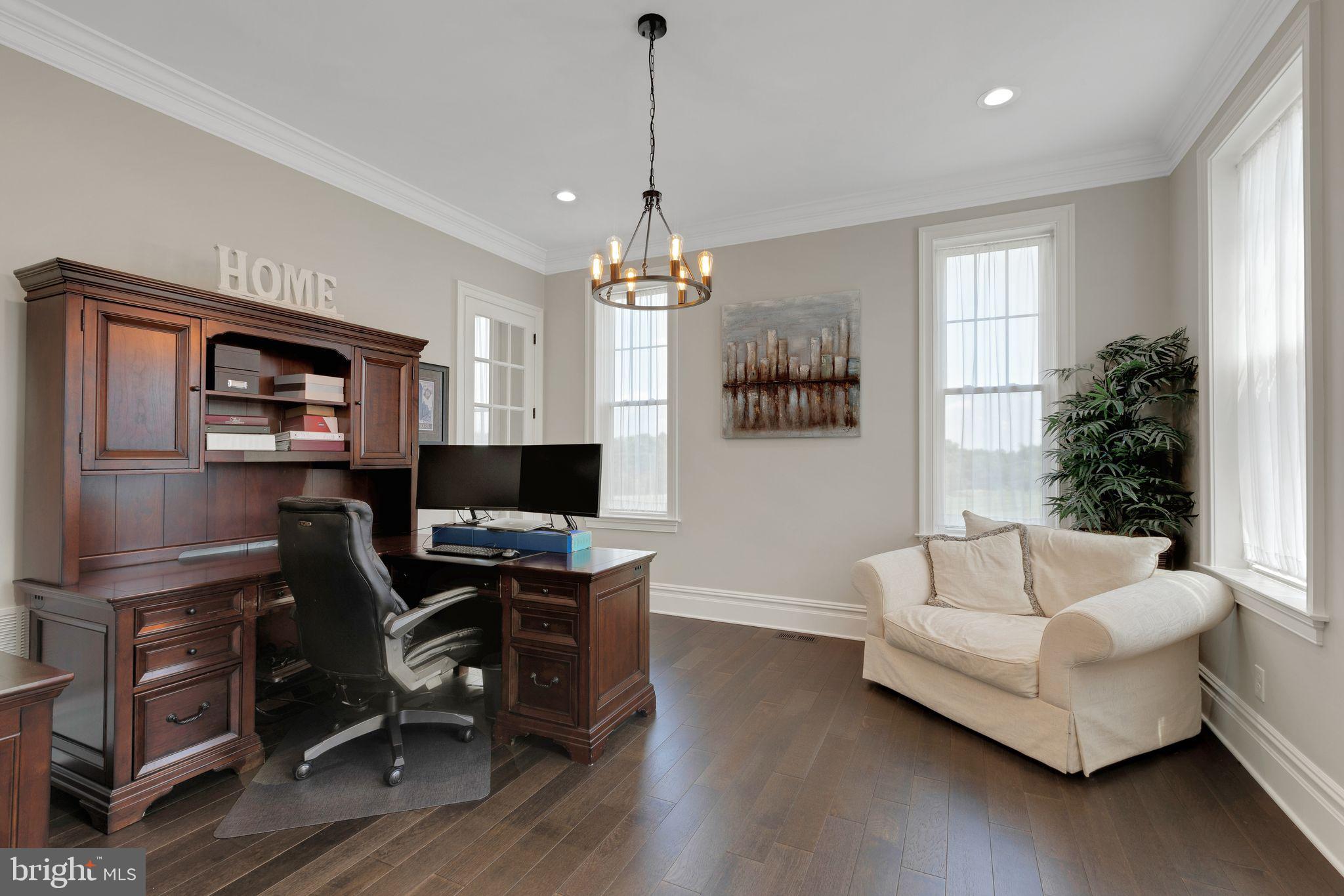 15 Marquis Ridge Holland, PA 18966 - Photo 10 of 83 a living room with furniture a desk and a flat screen tv