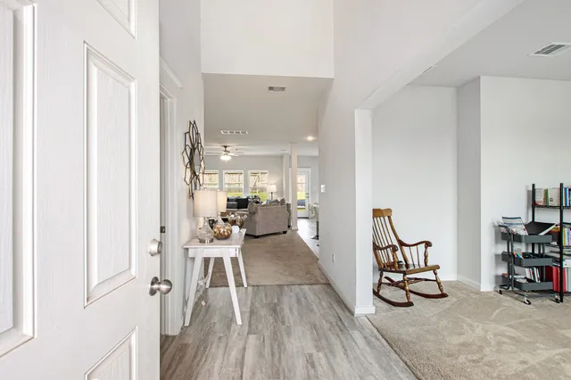 a view of a livingroom with furniture and a hardwood floor