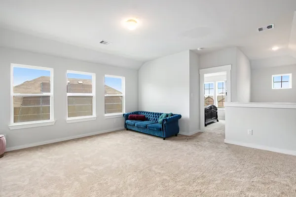 an entryway and livingroom with furniture