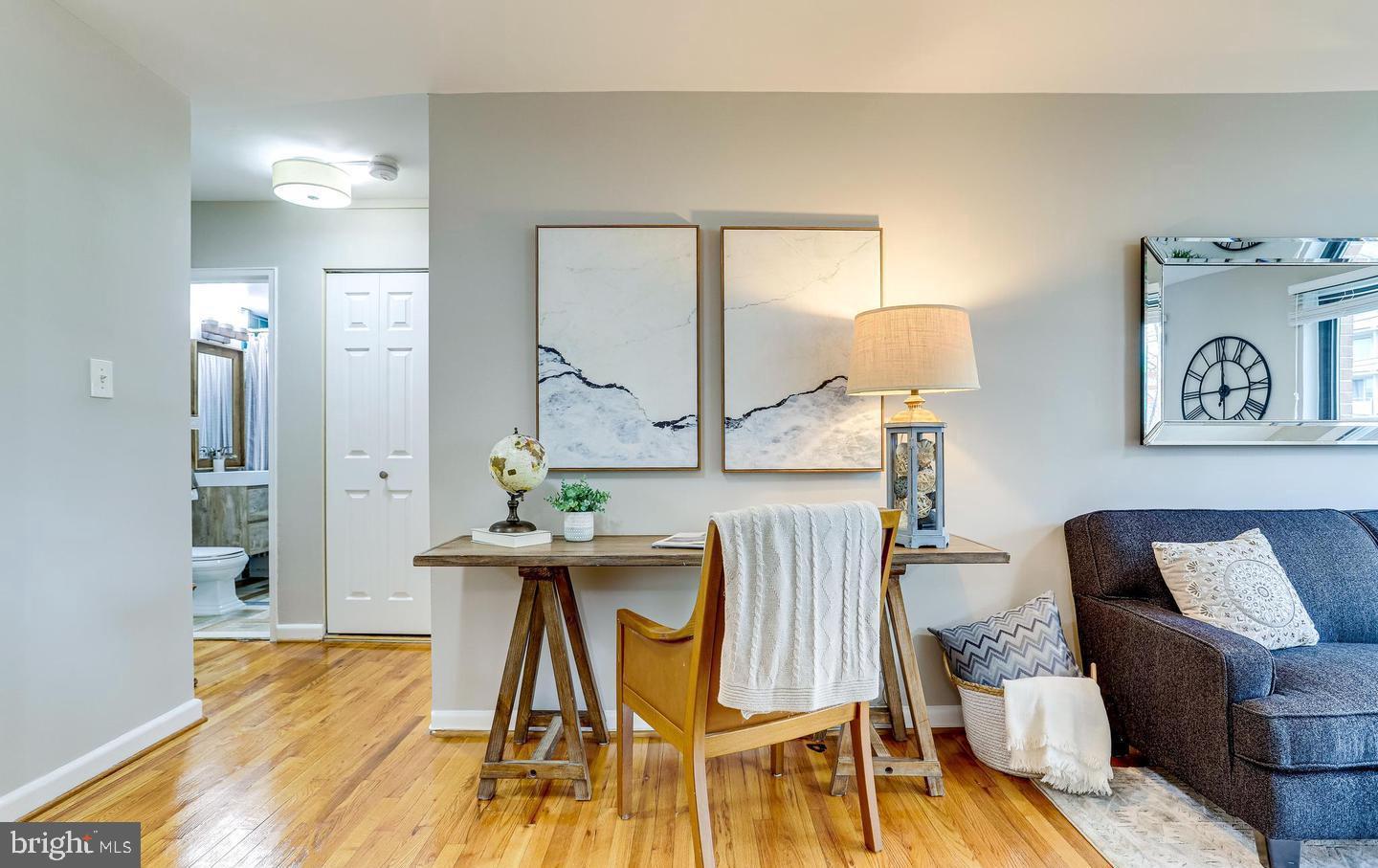 1200 South Arlington Ridge Road, Unit 608 Arlington, VA 22202 - Photo 5 of 16 a view of a dining room with furniture and wooden floor