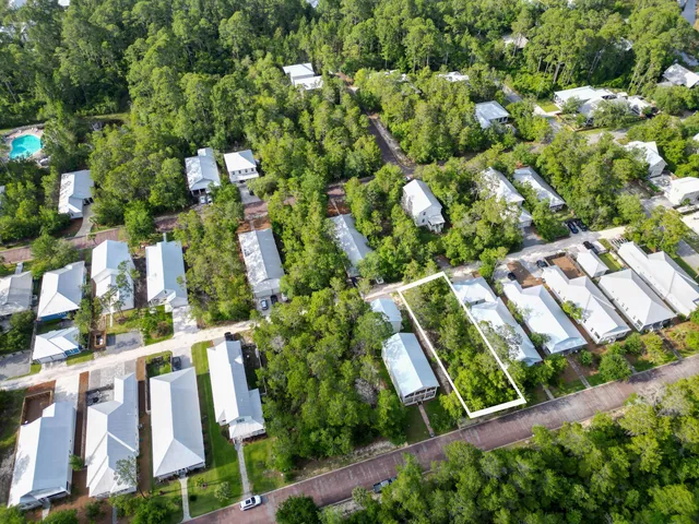 an aerial view of a house with garden space sitting space and swimming pool