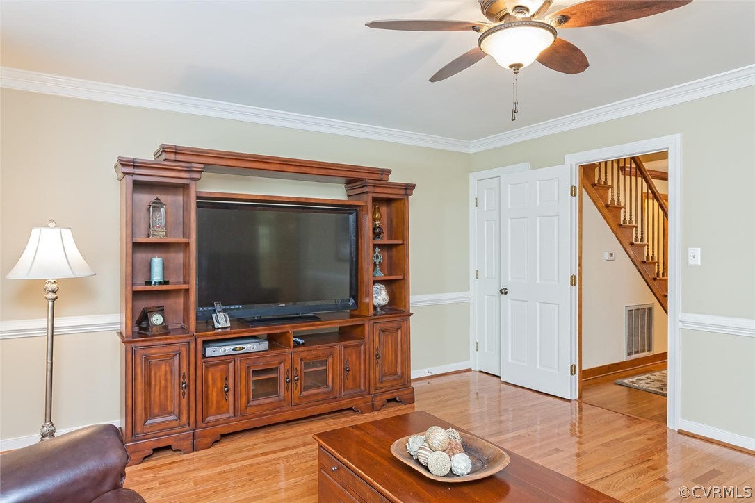 5710 Deep Forest Road Richmond, VA 23237 - Photo 19 of 40 a living room with furniture and a flat screen tv