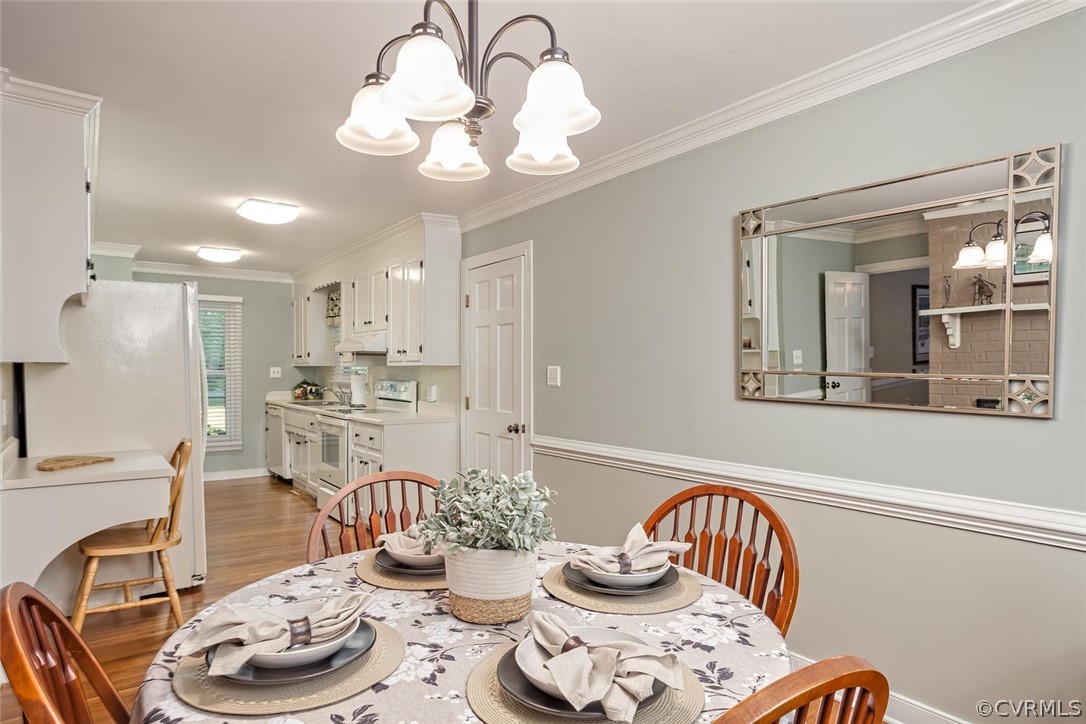 5710 Deep Forest Road Richmond, VA 23237 - Photo 23 of 40 a living room with furniture and a dining table