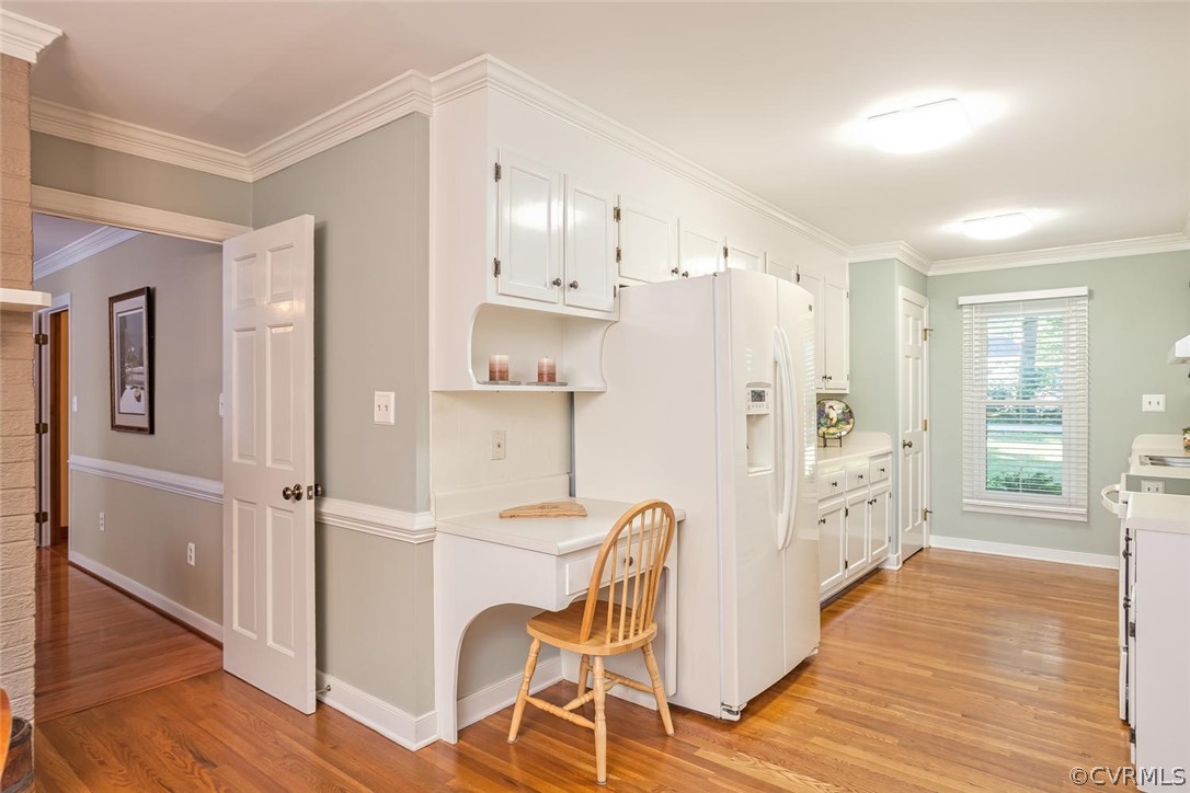 5710 Deep Forest Road Richmond, VA 23237 - Photo 24 of 40 a kitchen with stainless steel appliances a refrigerator sink and cabinets