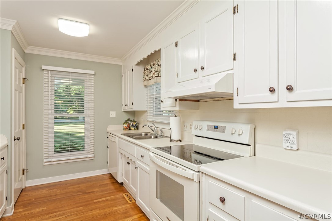 5710 Deep Forest Road Richmond, VA 23237 - Photo 25 of 40 a kitchen with stainless steel appliances white cabinets and a sink