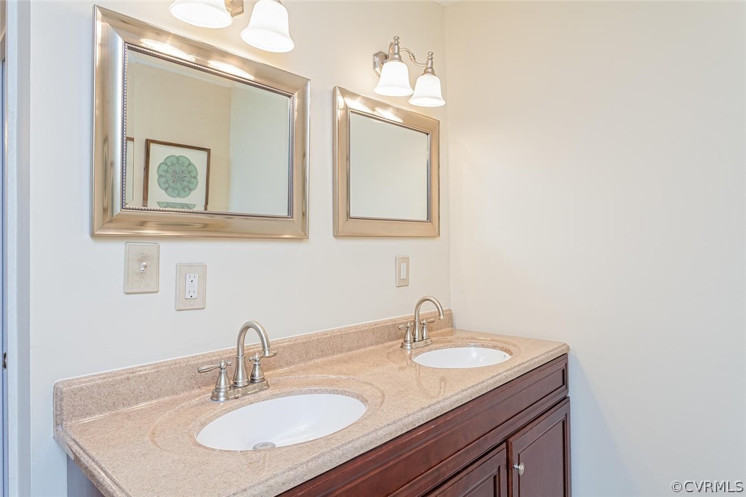 5710 Deep Forest Road Richmond, VA 23237 - Photo 30 of 40 a bathroom with a sink and a mirror