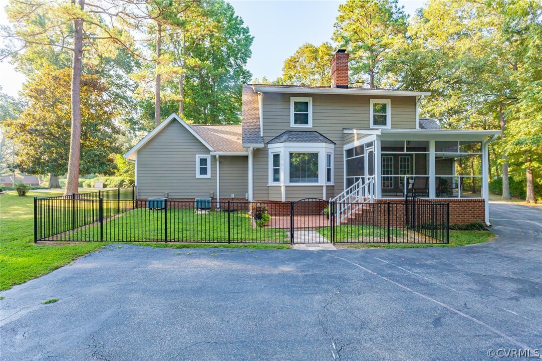 5710 Deep Forest Road Richmond, VA 23237 - Photo 7 of 40 a view of house with a big yard and large trees