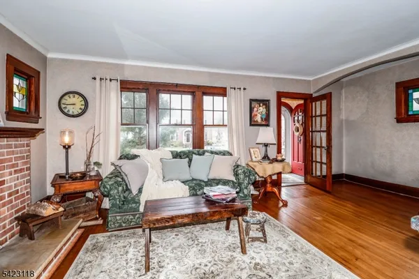 a bedroom with furniture and a flat screen tv