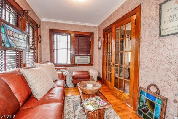 a view of room with window and cabinet
