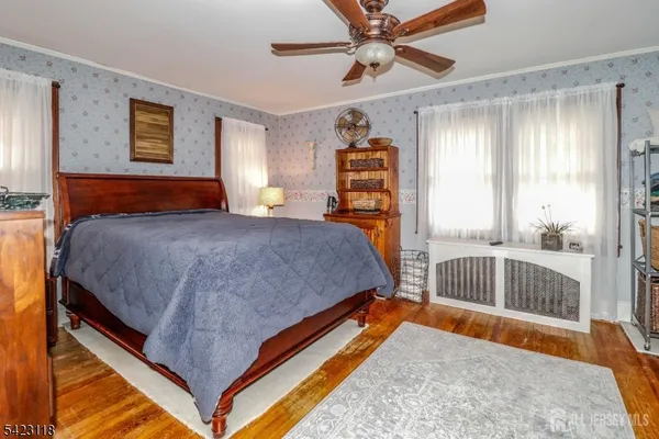 a room with a window and a chandelier