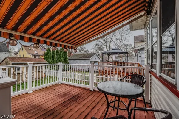 a view of a balcony with furniture