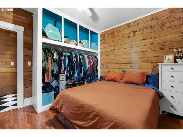 a bed room with a bed and a large window