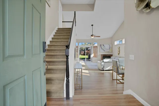 a view of entryway and hall with wooden floor