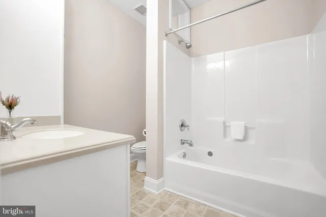 a bathroom with a sink a mirror and a bathtub