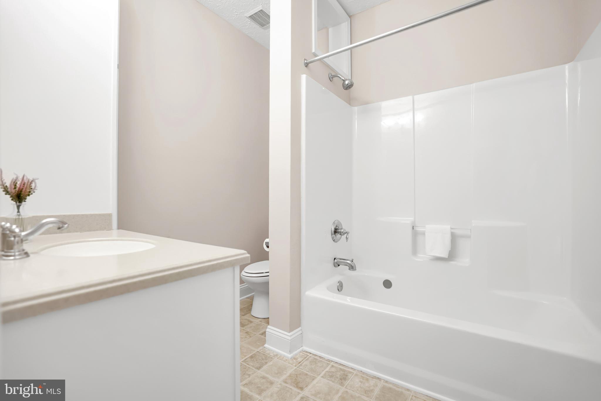 10717 Mt Sharon Road Orange, VA 22960 - Photo 14 of 35 a bathroom with a sink a mirror and a bathtub