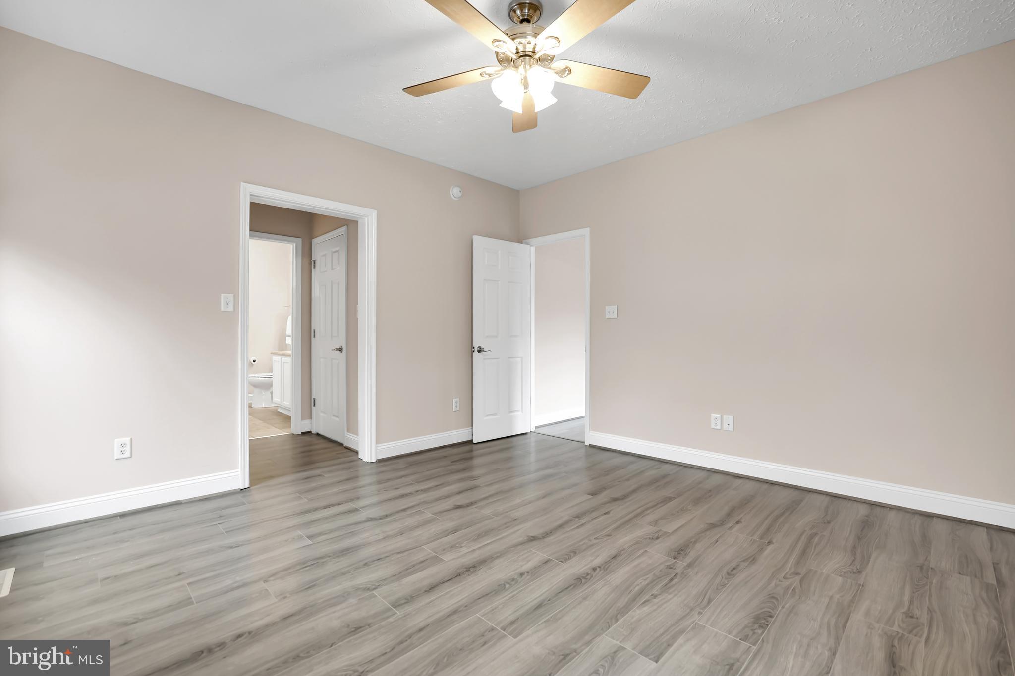 10717 Mt Sharon Road Orange, VA 22960 - Photo 20 of 35 a view of an empty room with window and wooden floor