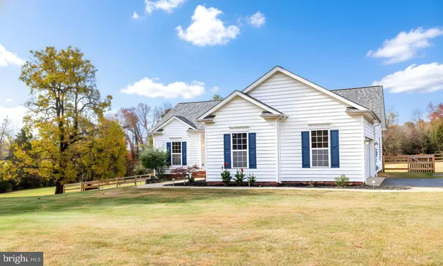 a front view of house with yard and swimming pool