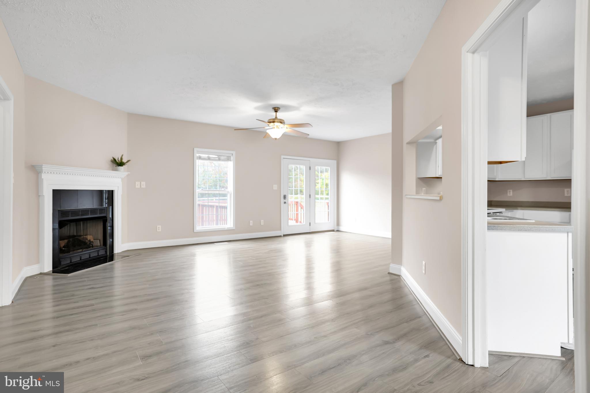 10717 Mt Sharon Road Orange, VA 22960 - Photo 8 of 35 a view of an empty room with wooden floor and a window