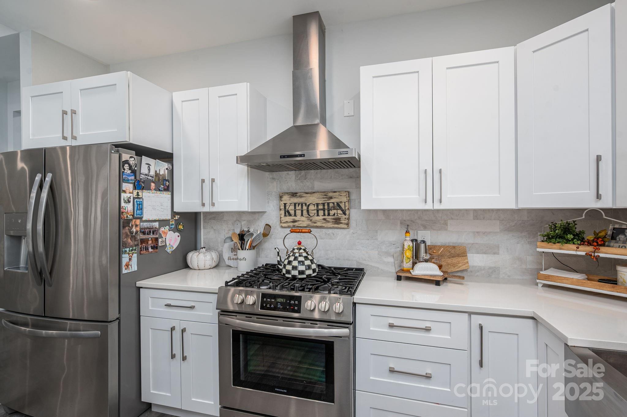 4290 Holly Circle Northeast Conover, NC 28613 - Photo 13 of 48 a kitchen with stainless steel appliances granite countertop a refrigerator a stove a sink and white cabinets