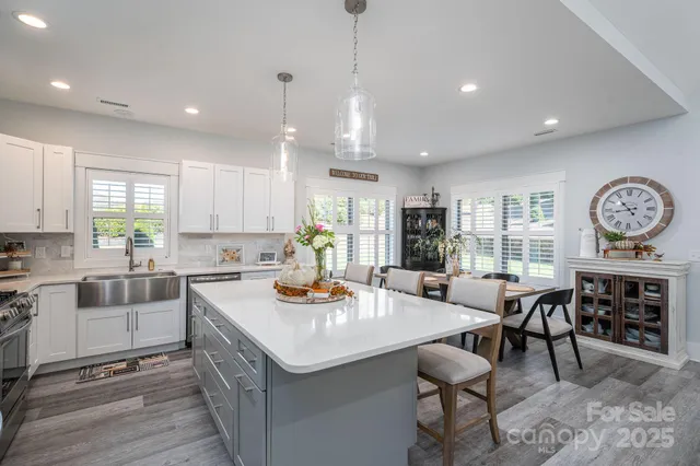 a view of kitchen with sink and stove