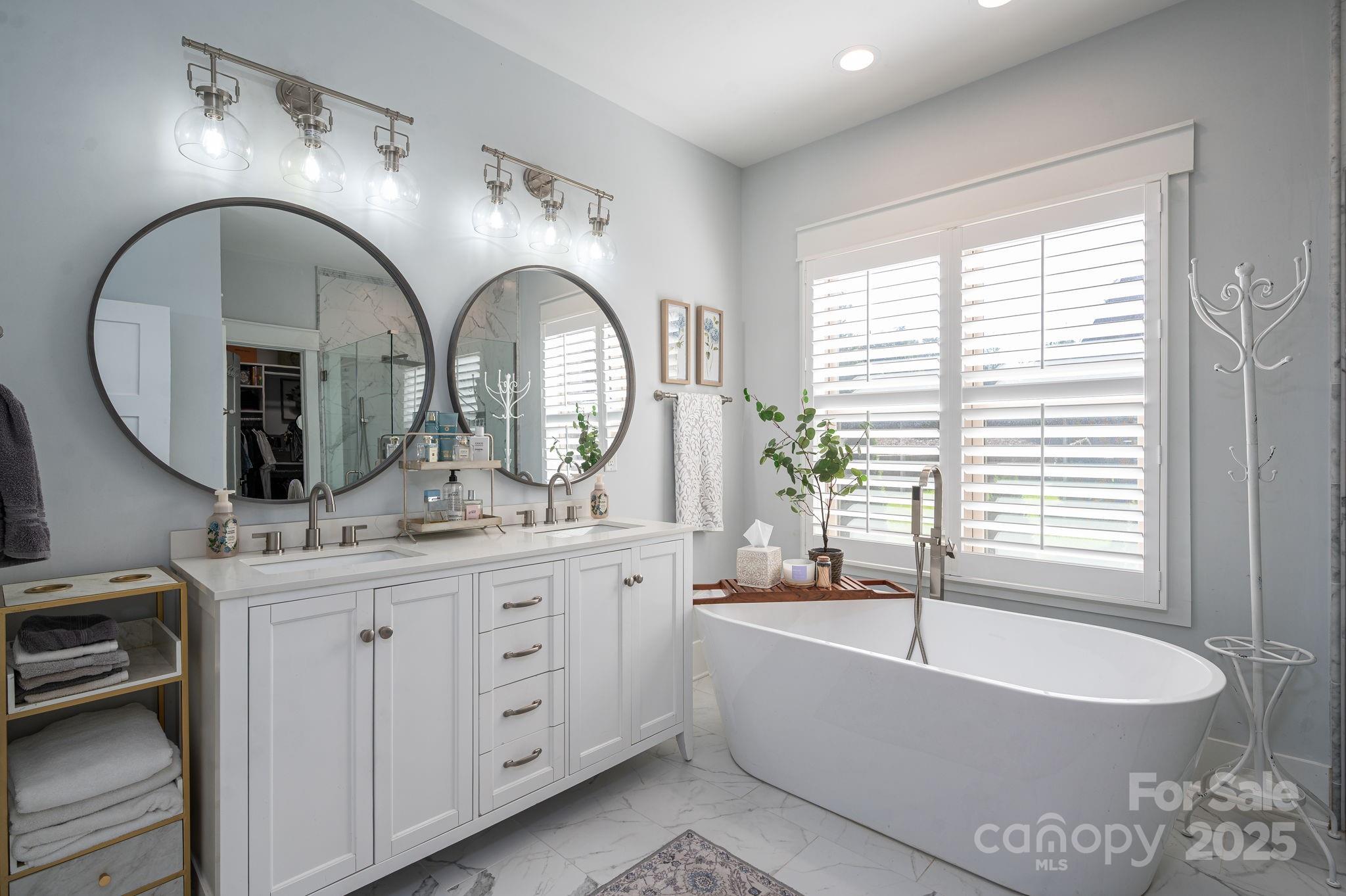 4290 Holly Circle Northeast Conover, NC 28613 - Photo 21 of 48 a spacious bathroom with a granite countertop sink a mirror a bathtub and next to a window
