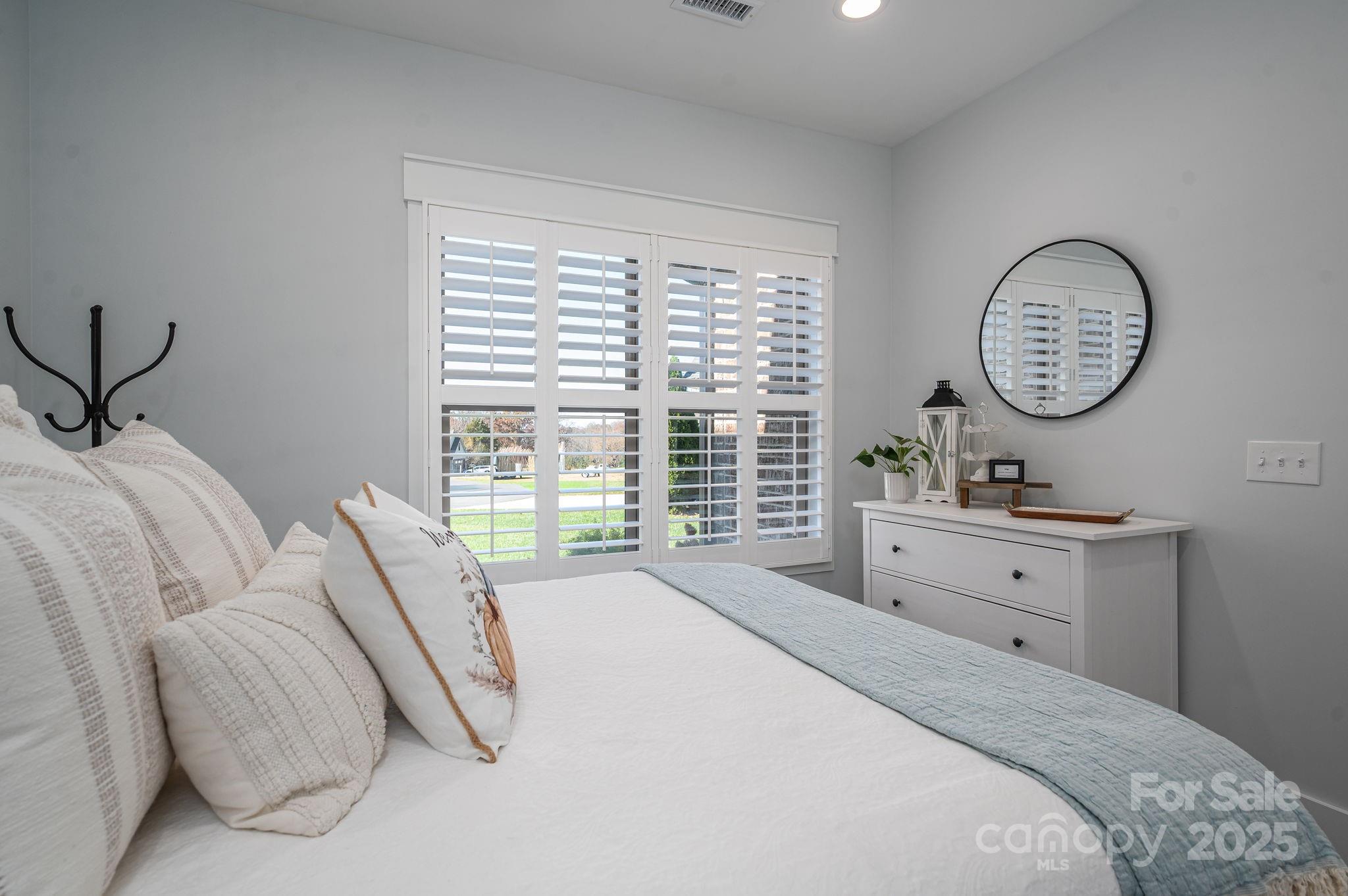 4290 Holly Circle Northeast Conover, NC 28613 - Photo 27 of 48 a spacious bedroom with a bed and a large window