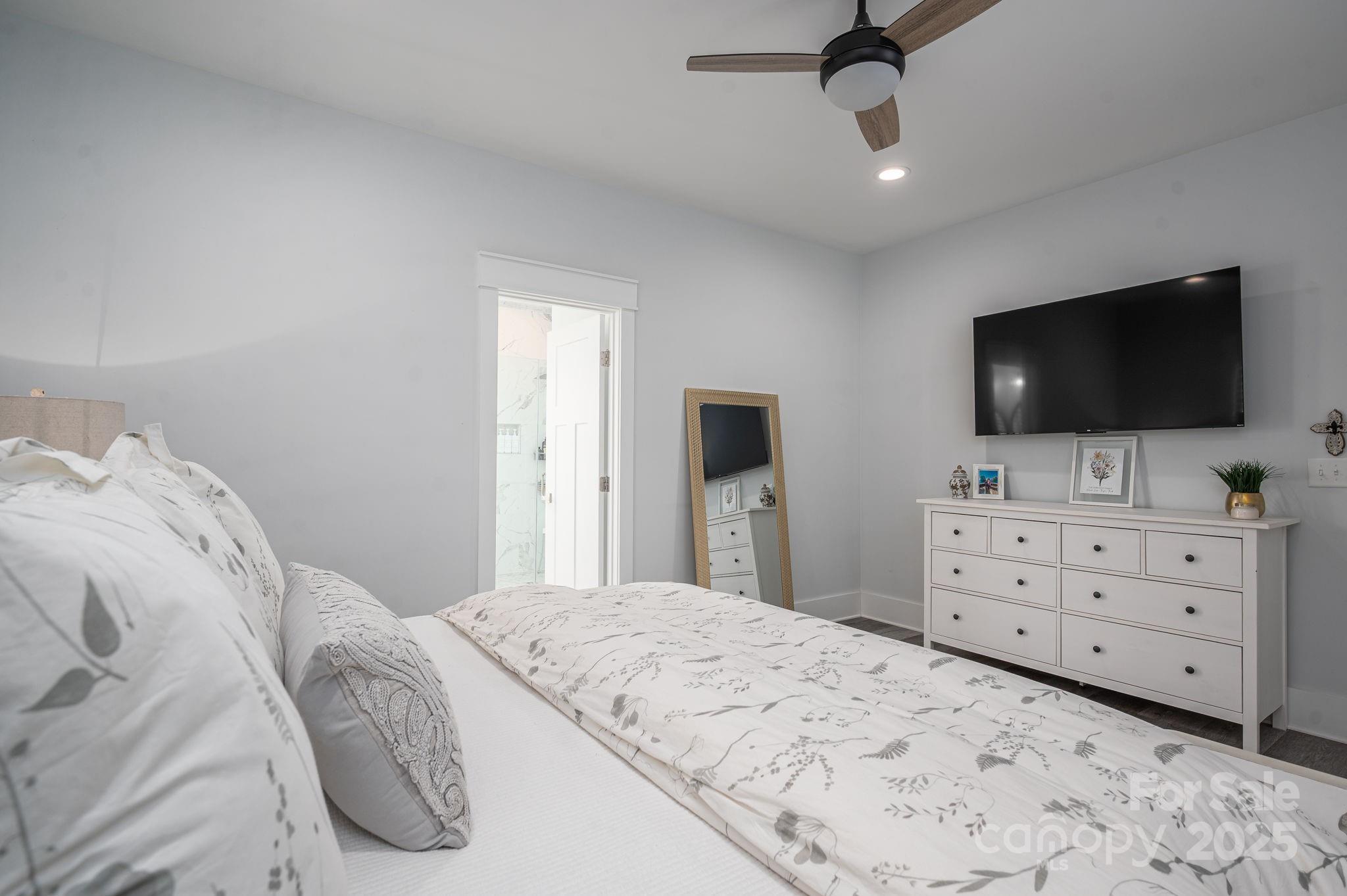 4290 Holly Circle Northeast Conover, NC 28613 - Photo 28 of 48 a bedroom with a bed and a flat screen tv