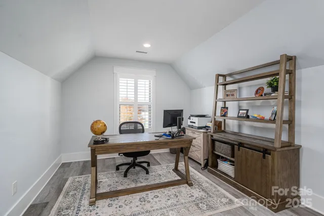 a view of a workspace with furniture