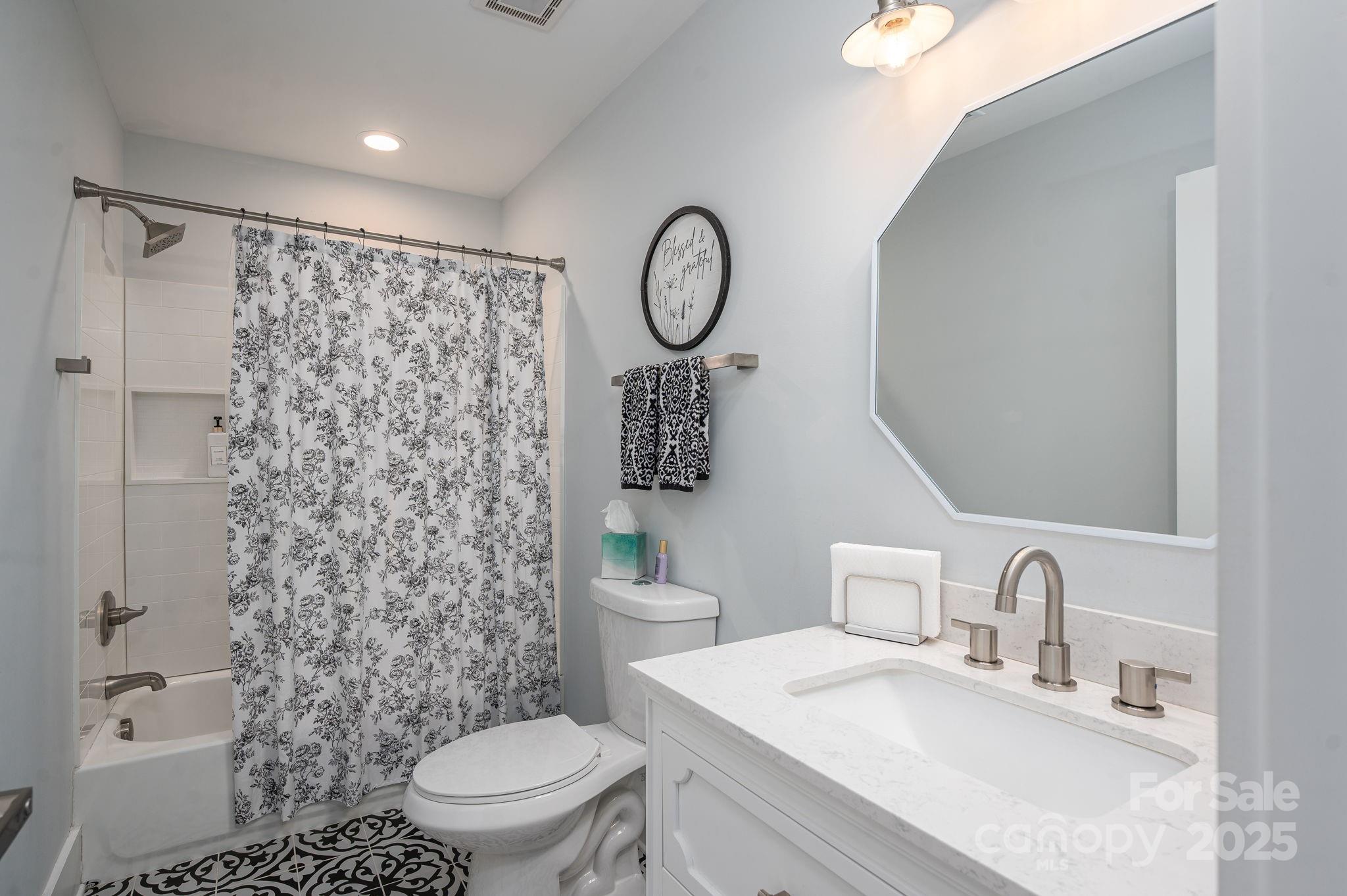 4290 Holly Circle Northeast Conover, NC 28613 - Photo 32 of 48 a bathroom with a toilet a sink and a shower