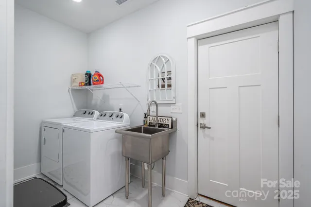 a view of a storage and utility room with a sink