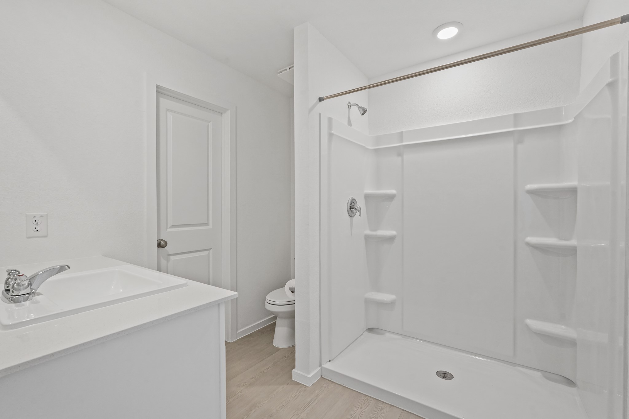 26931 Feather Reed Drive Katy, TX 77493 - Photo 8 of 16 The primary en-suite bathroom features a single-sink storage vanity with a white countertops and a functional Walk-in shower.