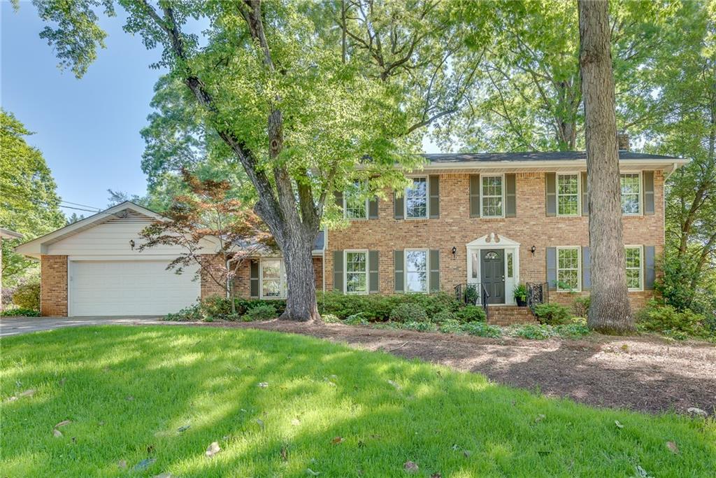 3003 Country Squire Lane Decatur, GA 30033 - Photo 1 of 1 a front view of house with yard and green space