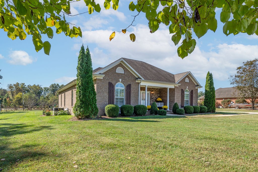 114 Hummingbird Lane Lawrenceburg, TN 38464 - Photo 1 of 38 a front view of house with yard and green space