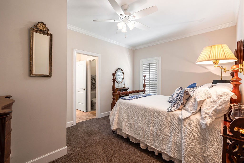 114 Hummingbird Lane Lawrenceburg, TN 38464 - Photo 22 of 38 a bedroom with a bed and a chandelier