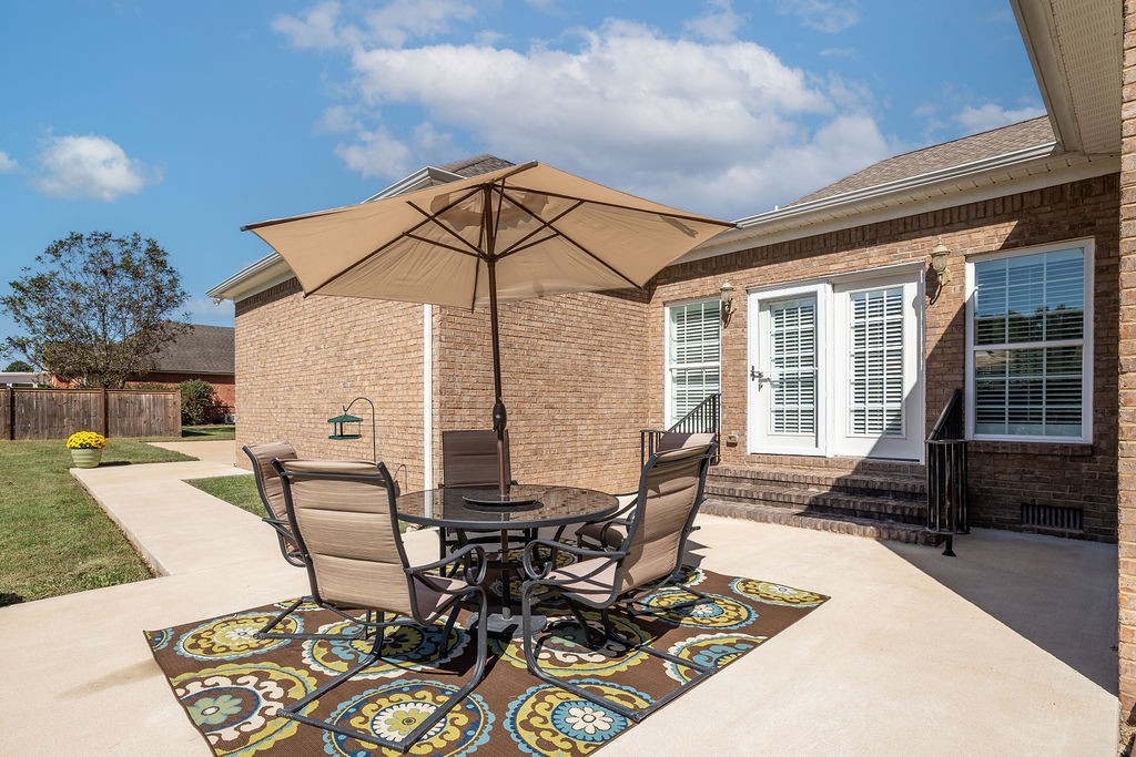 114 Hummingbird Lane Lawrenceburg, TN 38464 - Photo 33 of 38 a view of a dinning table and chairs in the patio