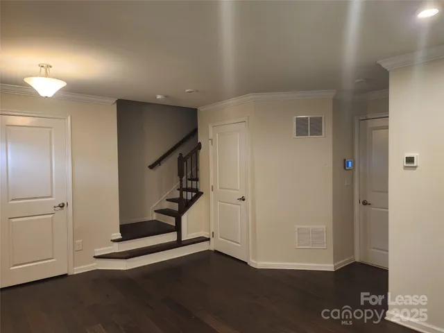 a view of an entryway with wooden floor