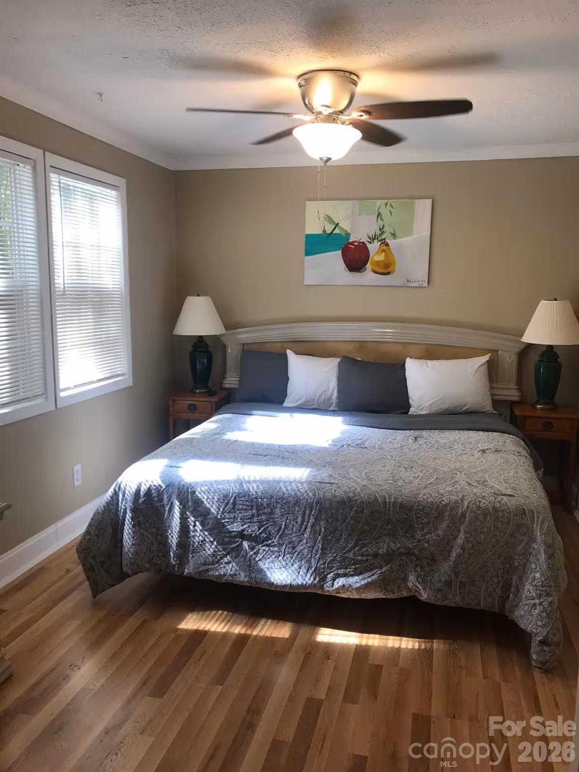73 Pine Road Rosman, NC 28772 - Photo 9 of 45 a bedroom with a bed and a chandelier