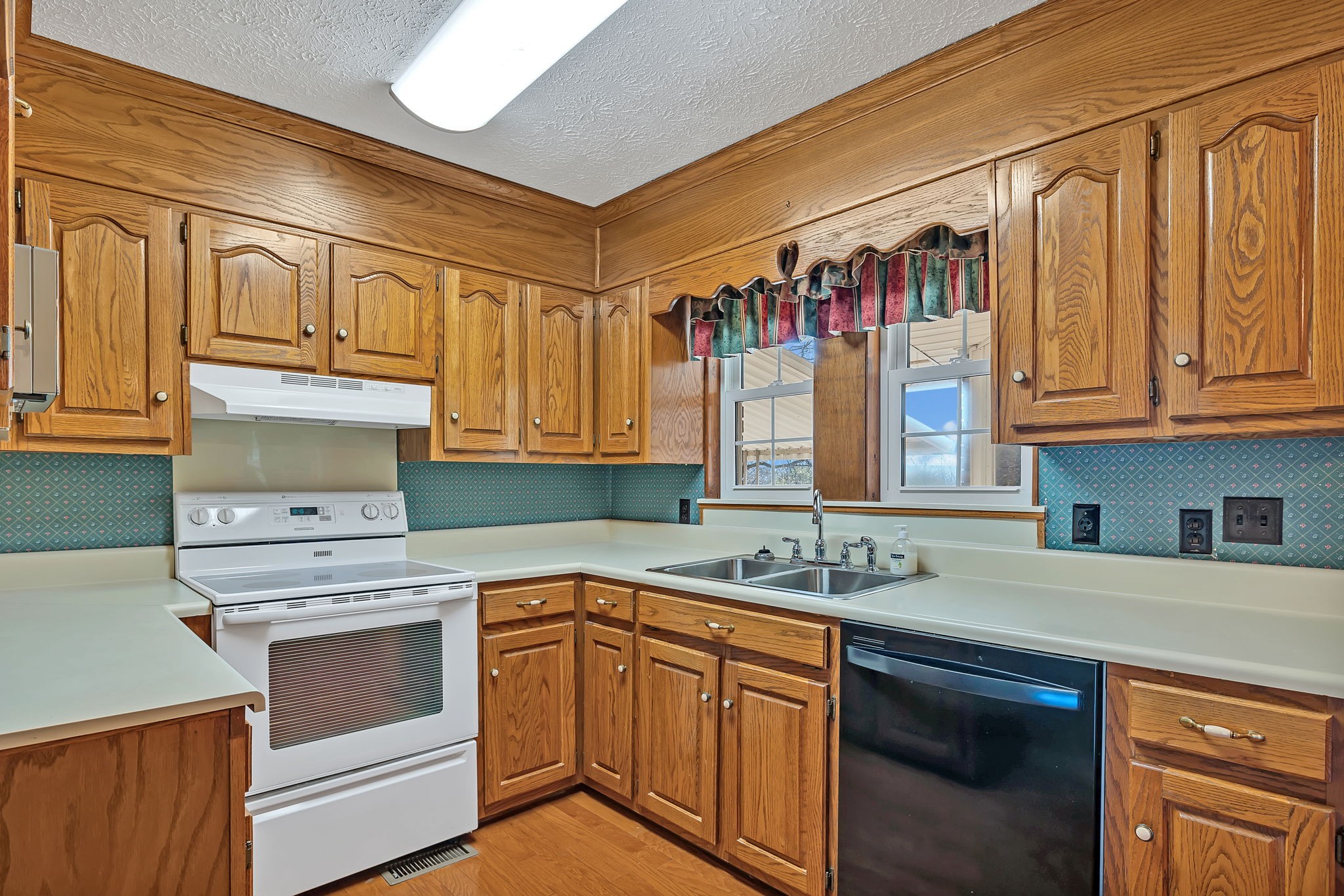 623 Highway 50 Centerville, TN 37033 - Photo 18 of 69 a kitchen with stainless steel appliances granite countertop a sink and cabinets