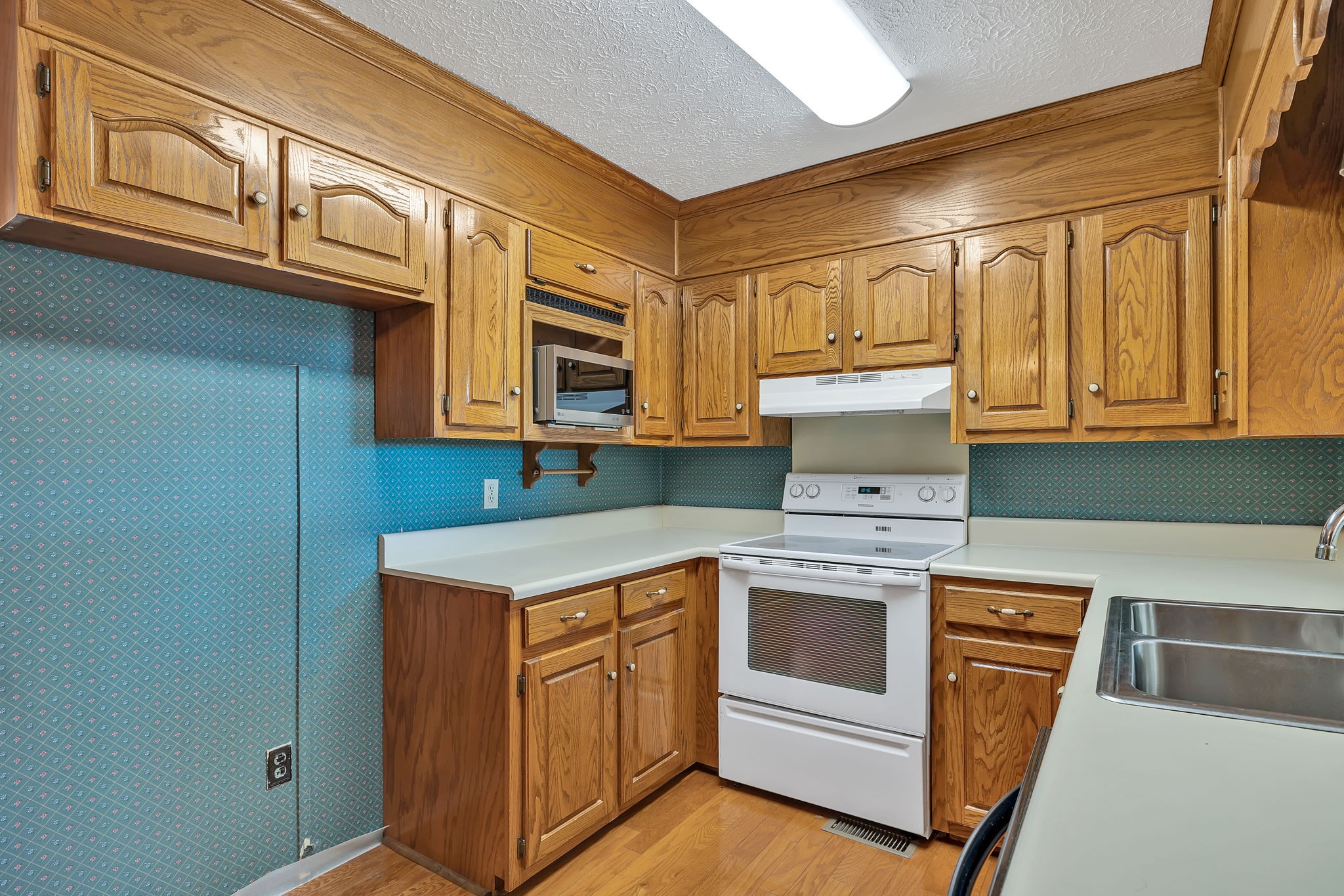623 Highway 50 Centerville, TN 37033 - Photo 19 of 69 a kitchen with stainless steel appliances granite countertop a stove and a microwave