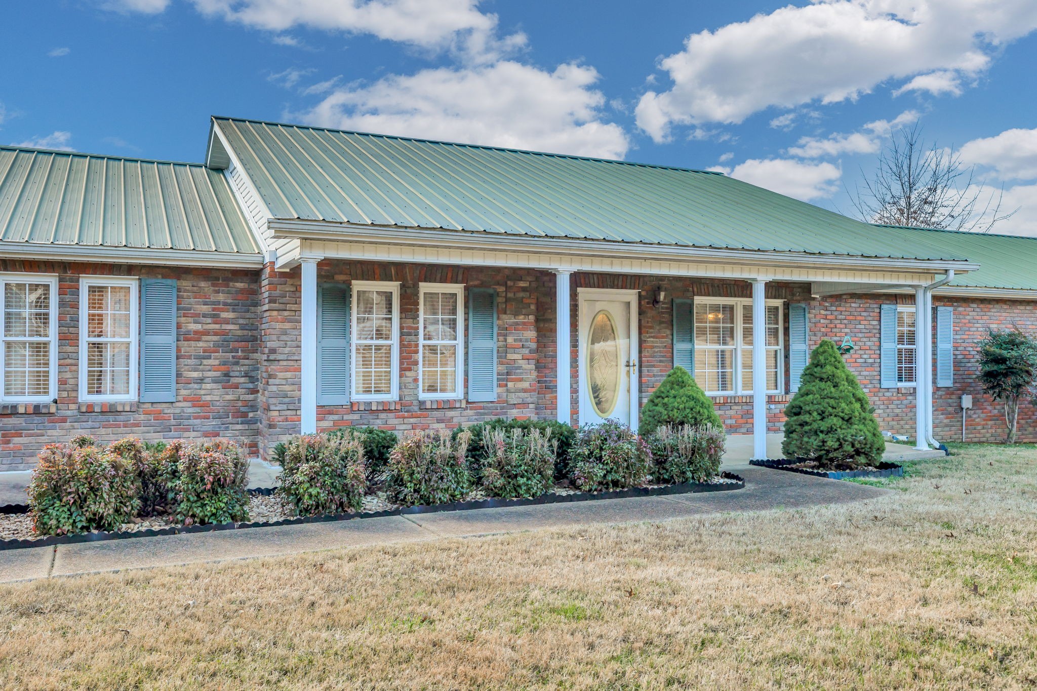 623 Highway 50 Centerville, TN 37033 - Photo 5 of 69 a front view of a house with garden