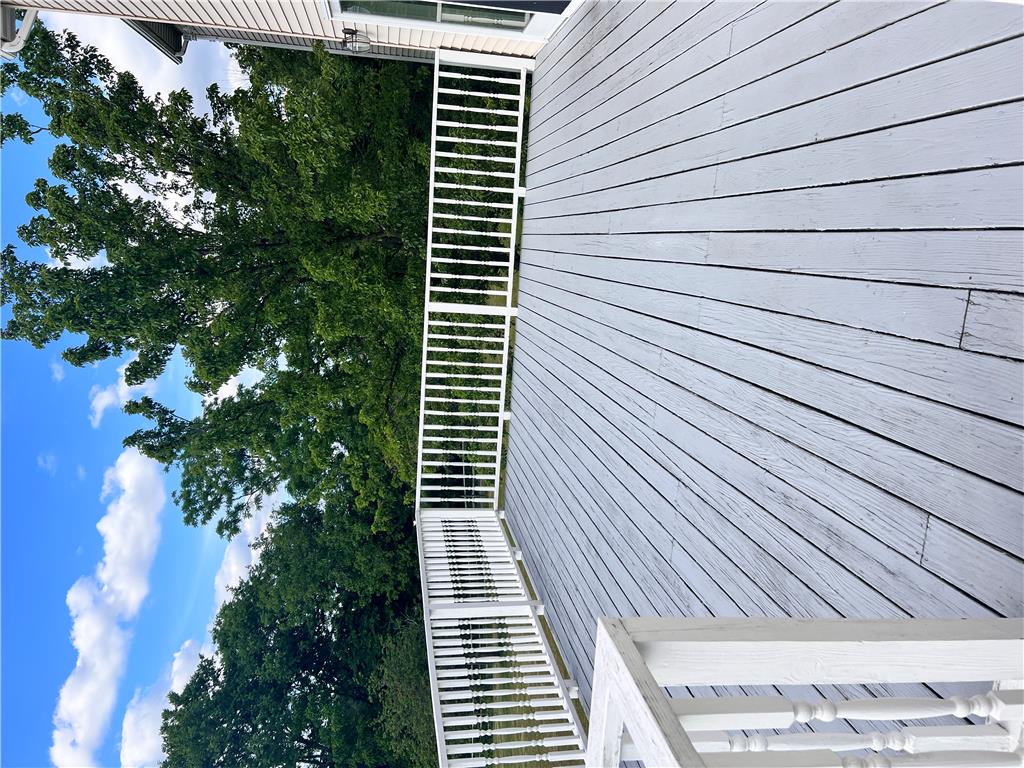 630 Clearfield Road Nazareth, PA 18064 - Photo 4 of 8 An inviting deck offers a serene outdoor space, perfect for relaxing amidst lush trees.