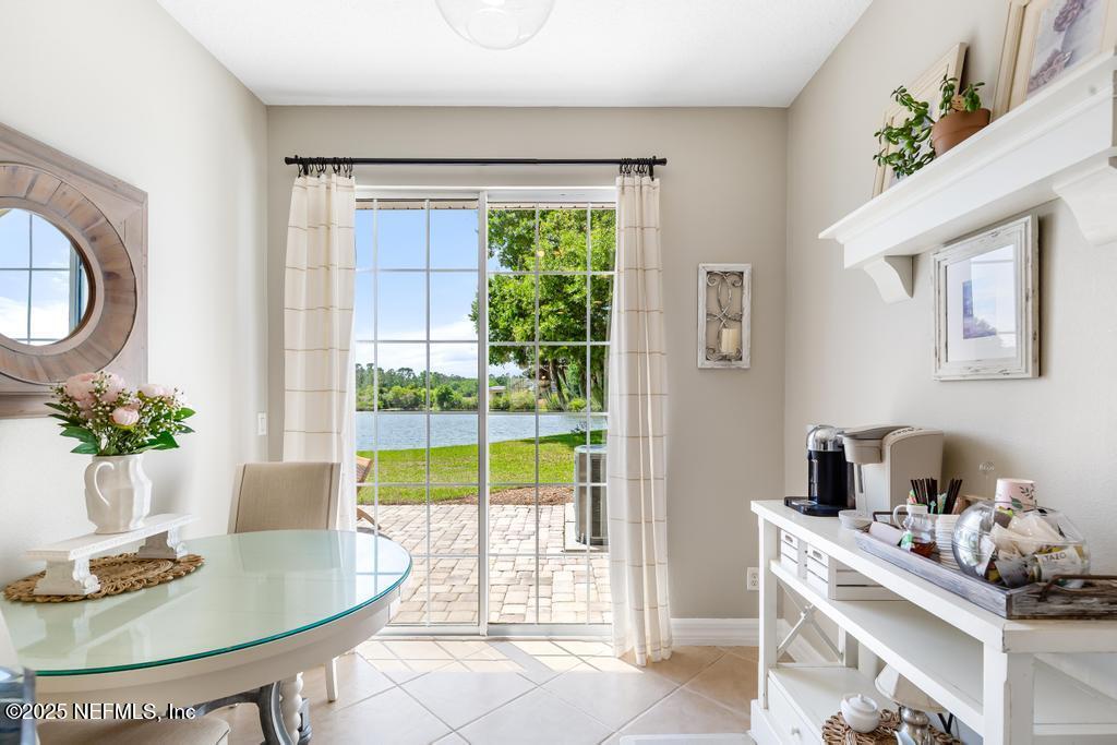 555 Hedgewood Drive St. Augustine, FL 32092 - Photo 15 of 70 a dining room with furniture and a window
