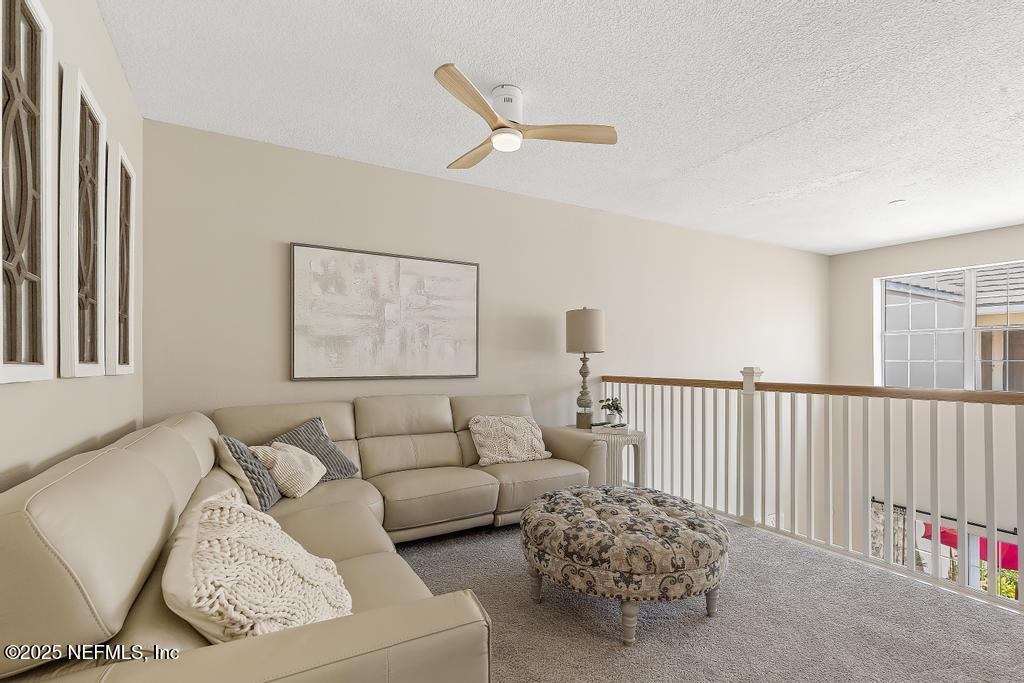 555 Hedgewood Drive St. Augustine, FL 32092 - Photo 25 of 70 a living room with furniture and a window