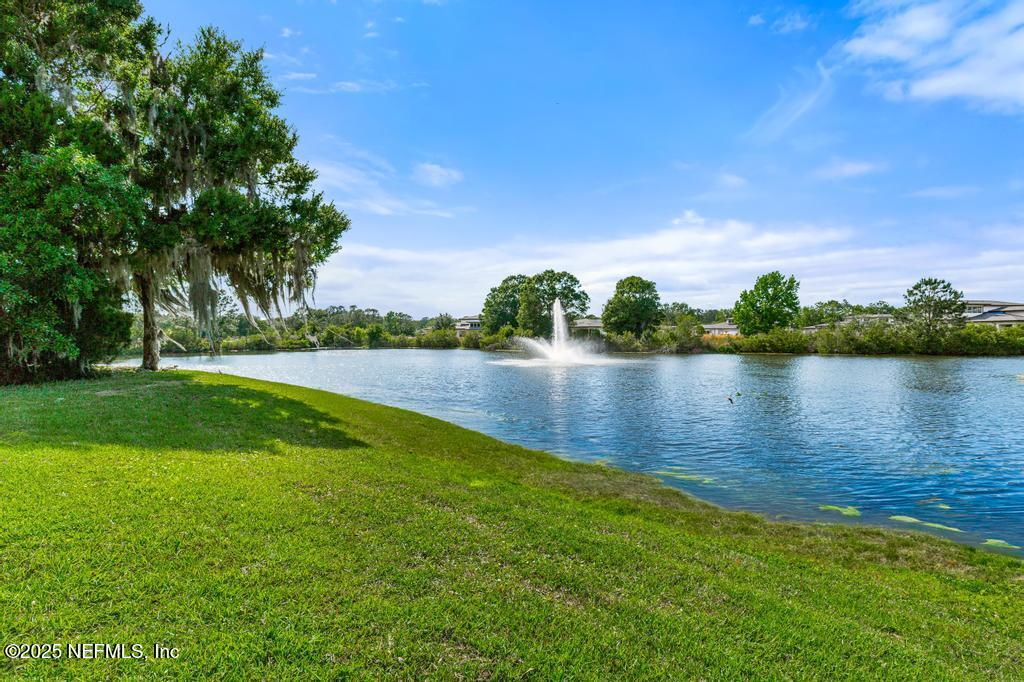 555 Hedgewood Drive St. Augustine, FL 32092 - Photo 37 of 70 a view of a lake with houses in the background