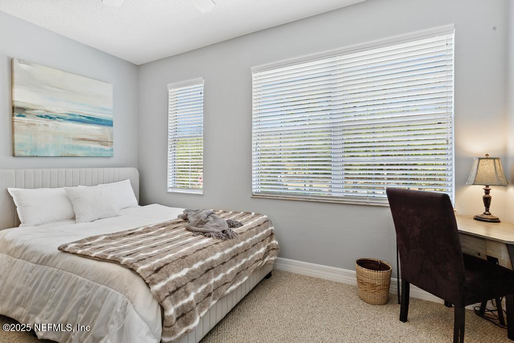 555 Hedgewood Drive St. Augustine, FL 32092 - Photo 45 of 70 a bedroom with a bed and a window