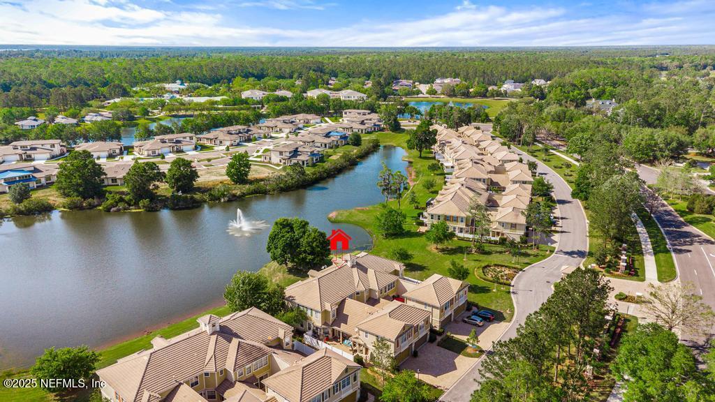 555 Hedgewood Drive St. Augustine, FL 32092 - Photo 52 of 70 an aerial view of lake and residential houses with outdoor space