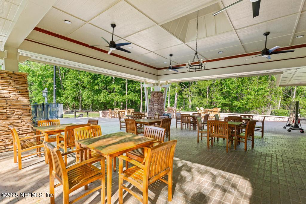 555 Hedgewood Drive St. Augustine, FL 32092 - Photo 55 of 70 a view of a dining room with furniture window and outside view