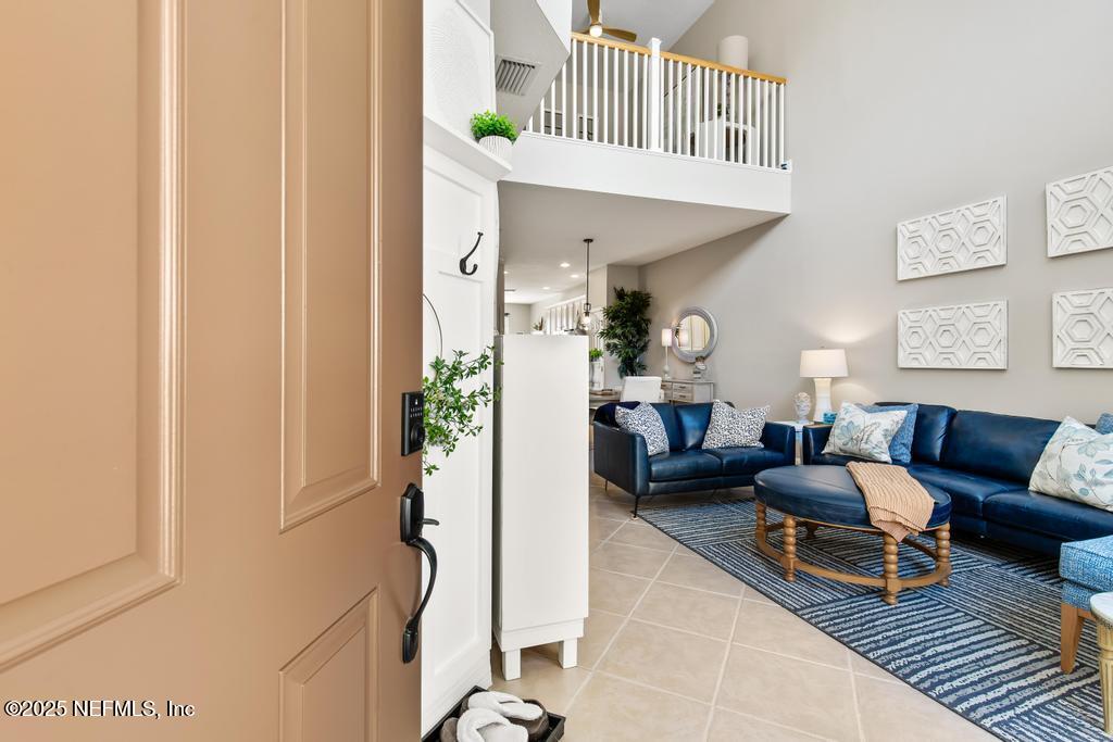 555 Hedgewood Drive St. Augustine, FL 32092 - Photo 6 of 70 a living room with furniture and a chandelier